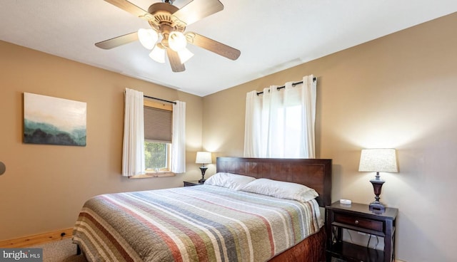 carpeted bedroom featuring ceiling fan