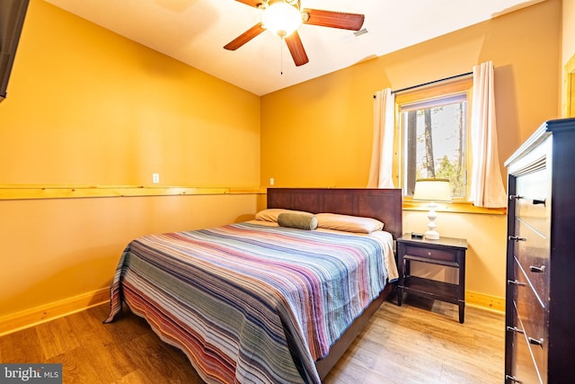 bedroom featuring light hardwood / wood-style floors and ceiling fan