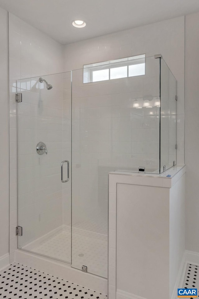 bathroom featuring tile patterned flooring and walk in shower