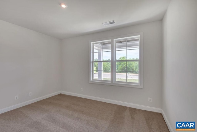 spare room with carpet floors