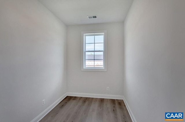 spare room with light wood-type flooring