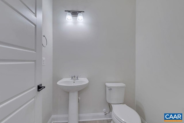 bathroom with toilet and sink