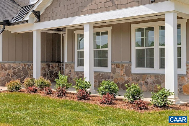 property entrance with a yard