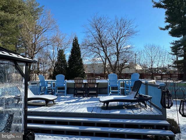 view of snow covered deck