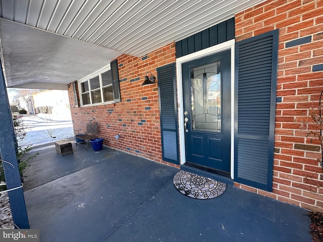 doorway to property with a porch