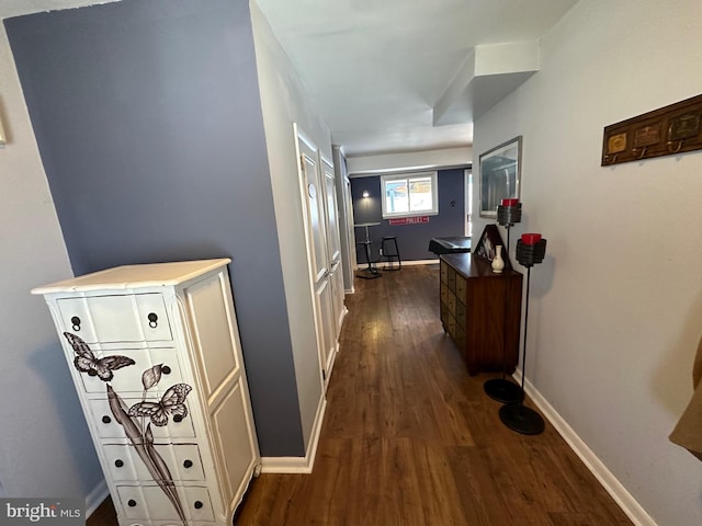 hallway with dark hardwood / wood-style floors