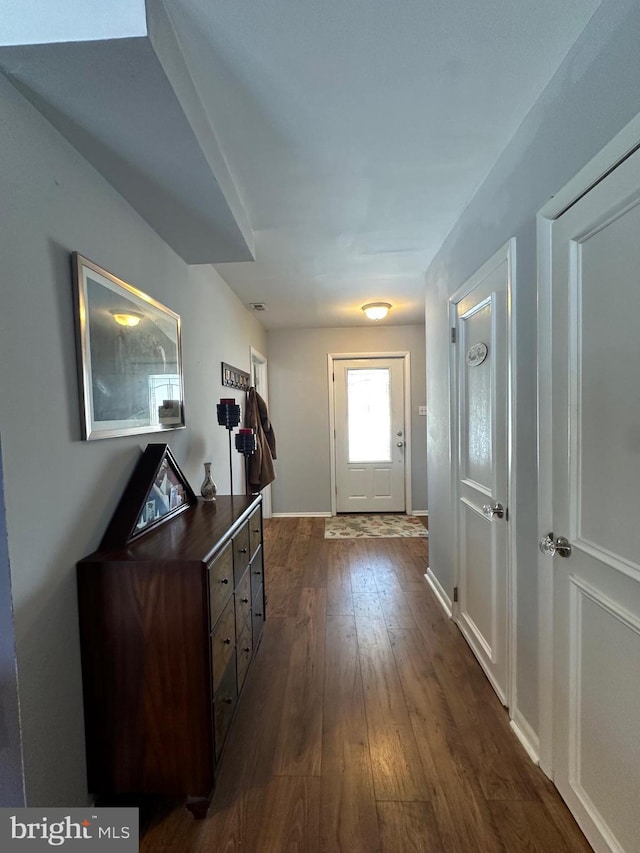 doorway featuring dark hardwood / wood-style floors