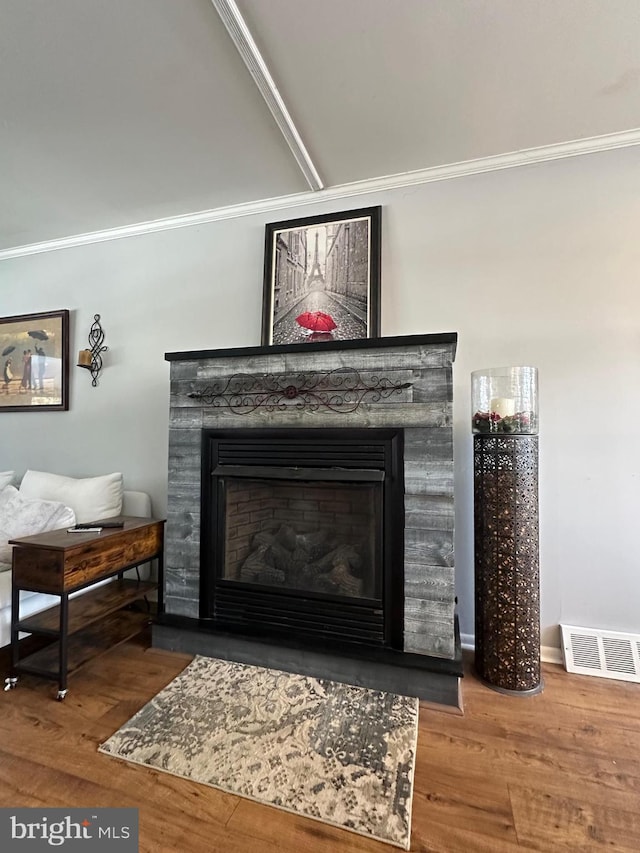 interior details featuring wood-type flooring and crown molding