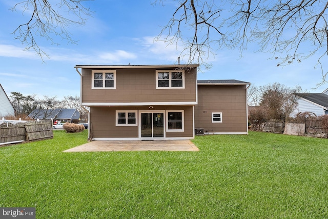 rear view of property with a lawn, central air condition unit, and a patio