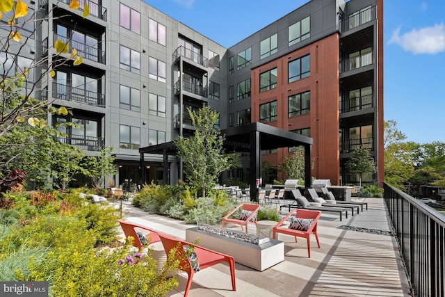 view of home's community featuring a fire pit