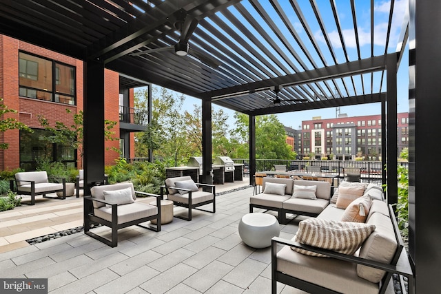 view of patio with a pergola, outdoor lounge area, and an outdoor kitchen