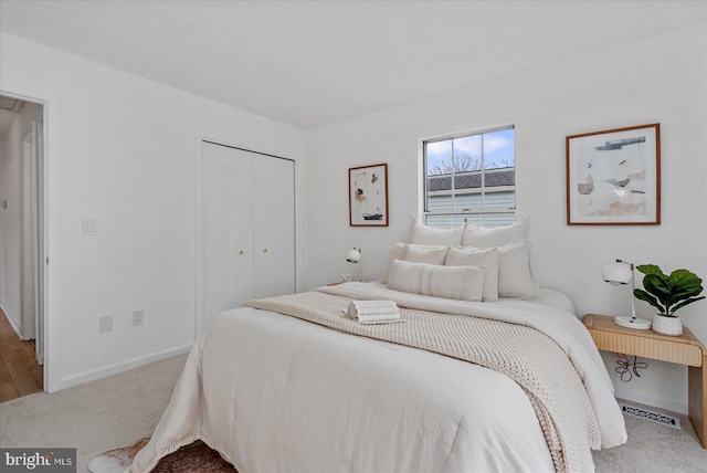 carpeted bedroom featuring a closet