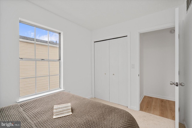 unfurnished bedroom with carpet floors and a closet