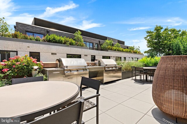 view of patio featuring area for grilling and exterior kitchen