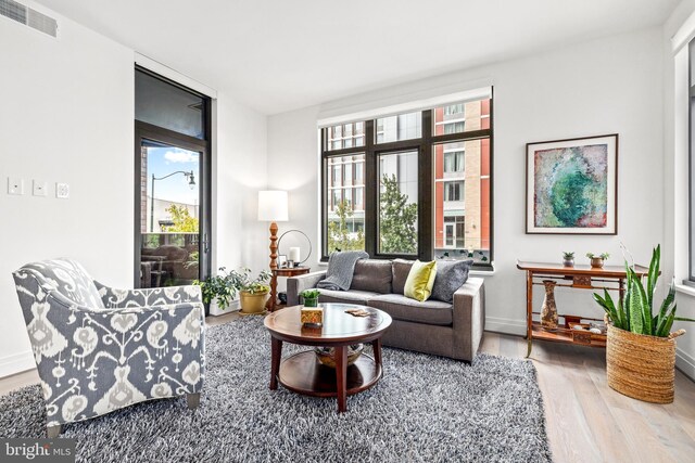 living area with hardwood / wood-style floors