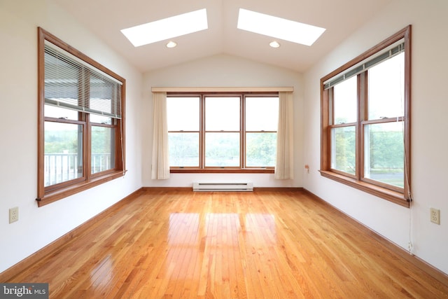 unfurnished room with recessed lighting, a baseboard radiator, vaulted ceiling with skylight, and light wood finished floors