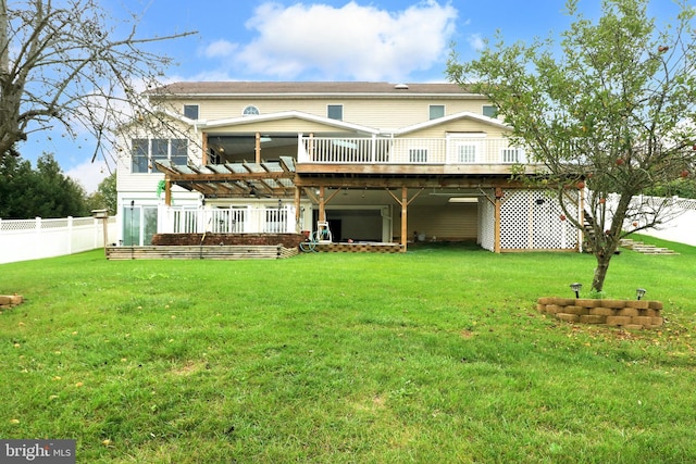 rear view of property featuring a yard, a fenced backyard, and a wooden deck