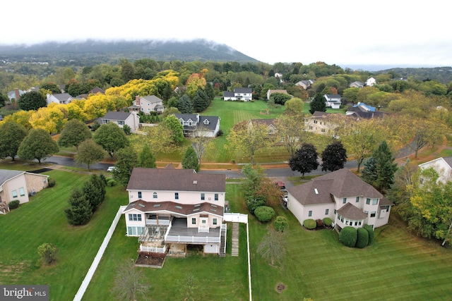 birds eye view of property with a residential view