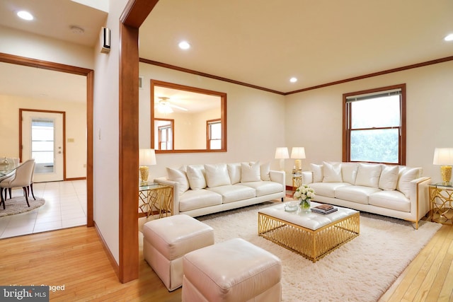 living area featuring light wood-style flooring, recessed lighting, and ornamental molding