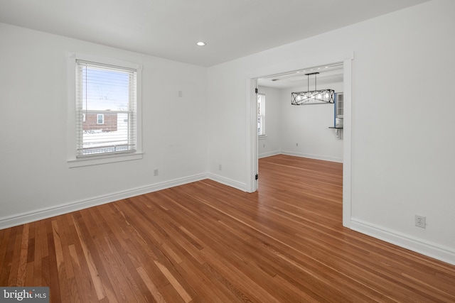 empty room featuring wood-type flooring