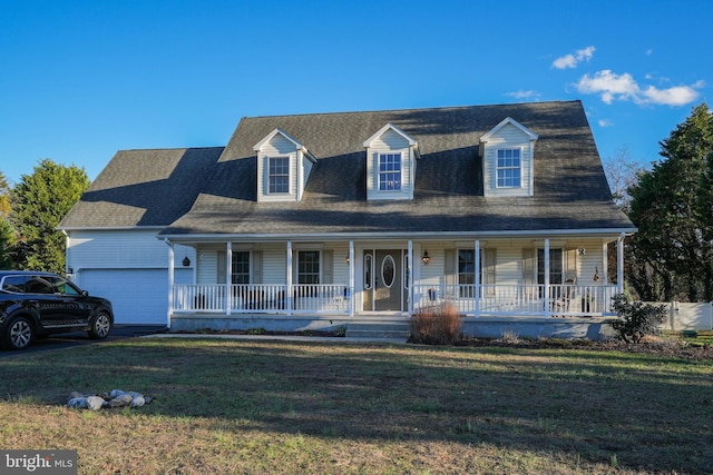 cape cod home featuring a porch, a garage, and a front lawn