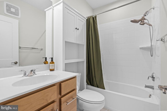 full bathroom featuring shower / bath combo with shower curtain, vanity, and toilet