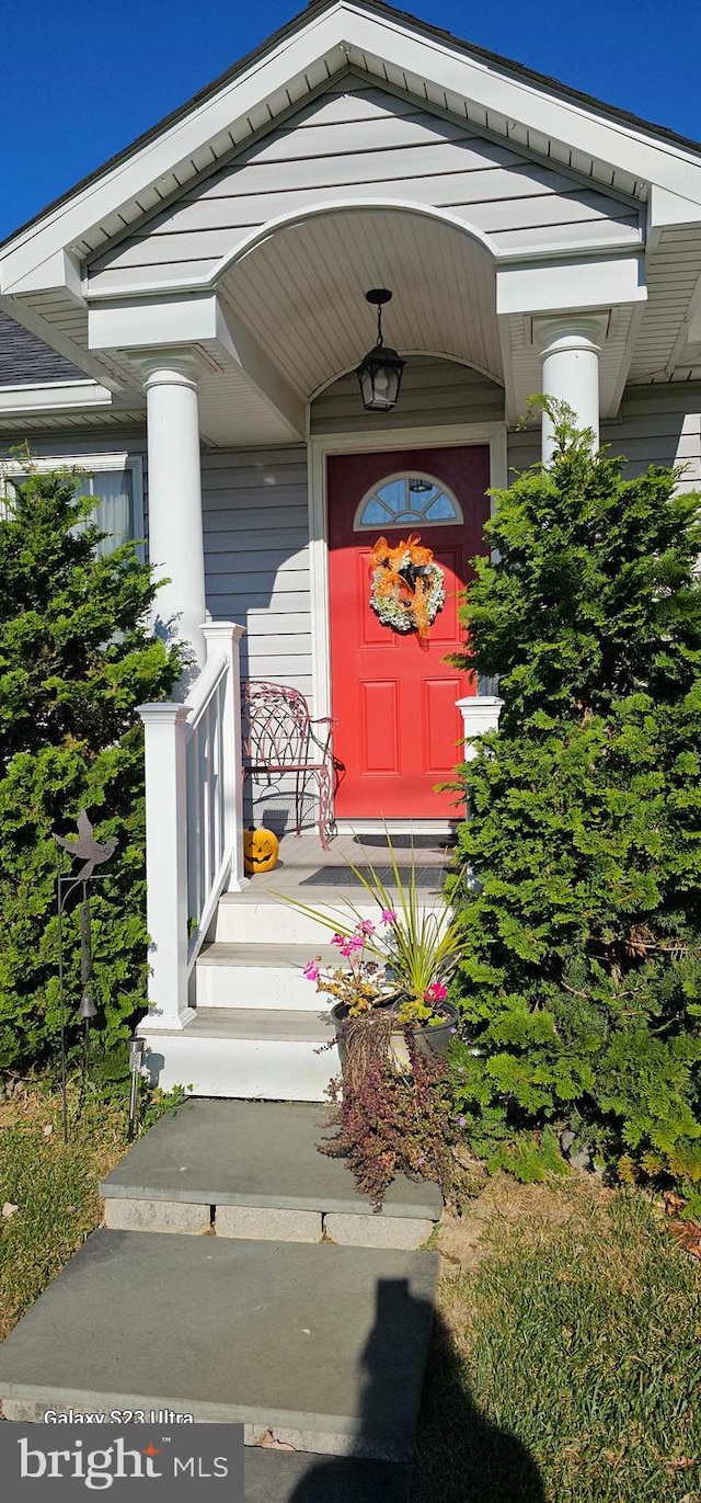 doorway to property with a porch