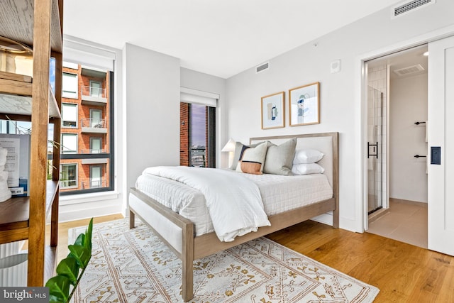 bedroom featuring light hardwood / wood-style floors