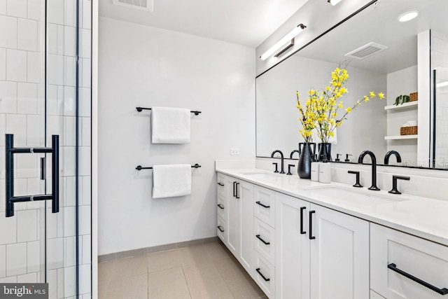 bathroom with tile patterned flooring and vanity