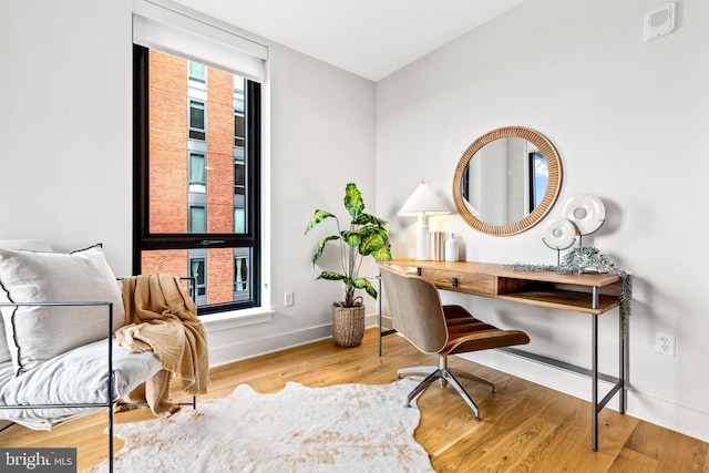 office space with a healthy amount of sunlight and wood-type flooring