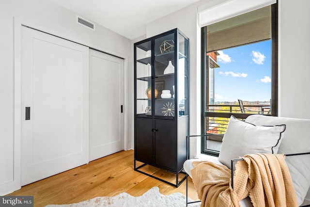 living area featuring hardwood / wood-style floors