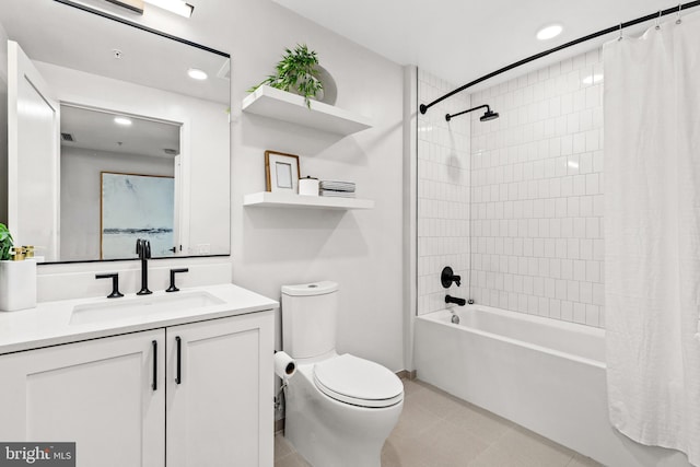 full bathroom featuring toilet, vanity, tile patterned floors, and shower / tub combo with curtain