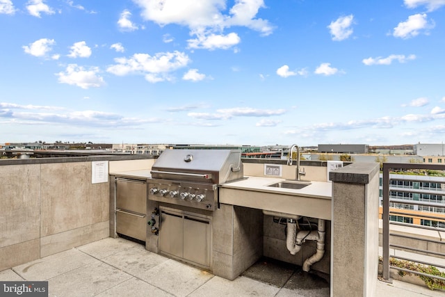 view of patio / terrace with area for grilling, exterior kitchen, and sink