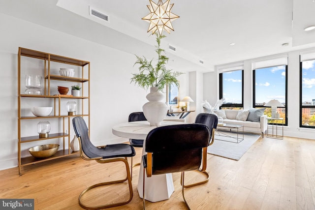 dining room with light hardwood / wood-style floors