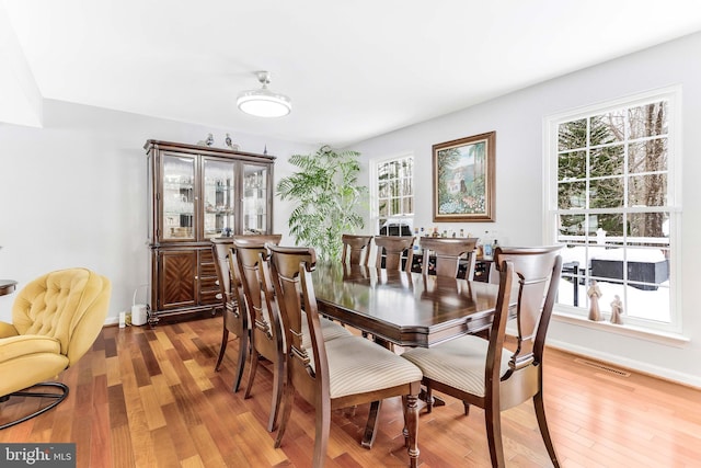 dining space featuring hardwood / wood-style flooring