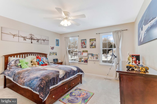 carpeted bedroom with ceiling fan