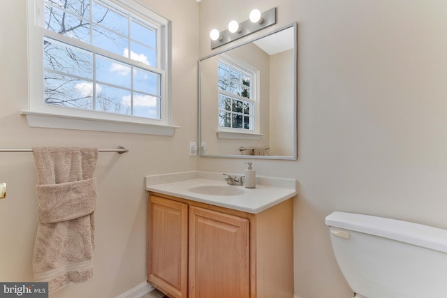 bathroom with vanity and toilet