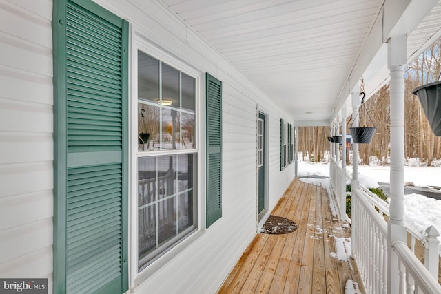 view of snow covered deck