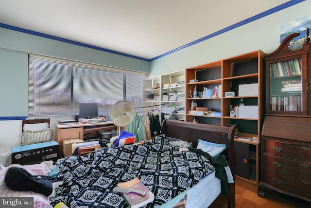 bedroom with parquet floors and ornamental molding