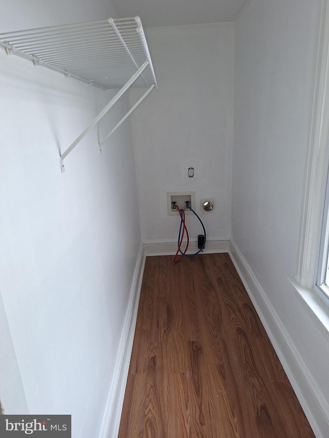 laundry room featuring hookup for a washing machine and dark hardwood / wood-style floors