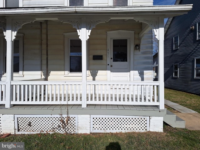 doorway to property featuring covered porch