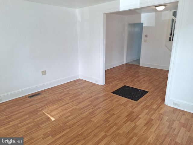 unfurnished room with light hardwood / wood-style flooring