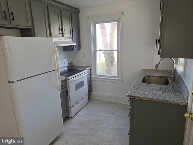 kitchen with white appliances and sink