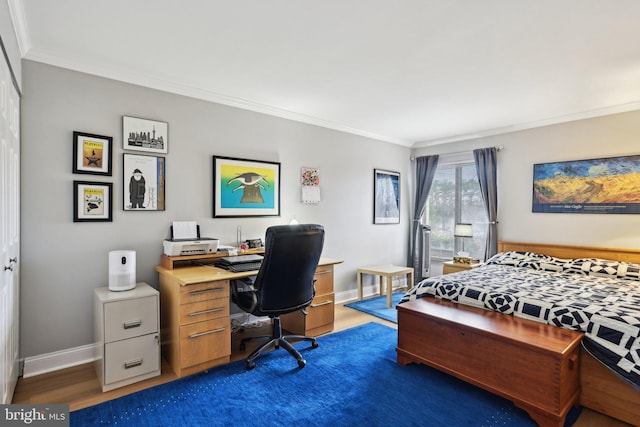 bedroom with ornamental molding, dark hardwood / wood-style floors, and a closet