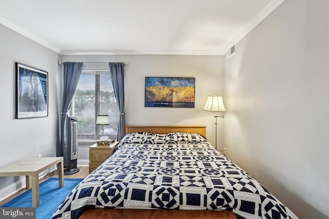 bedroom with ornamental molding