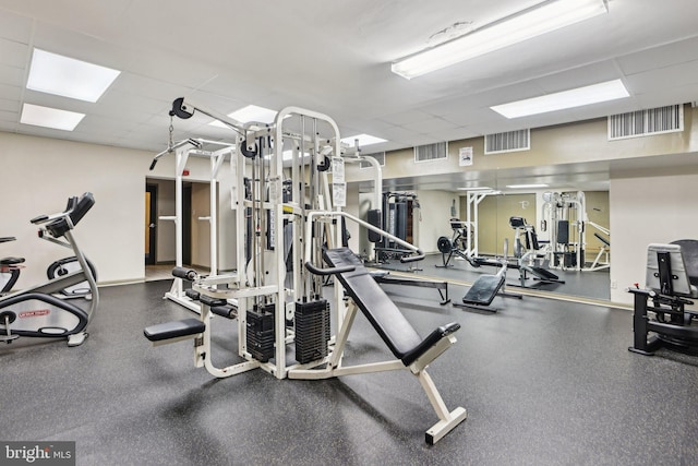 gym featuring a drop ceiling