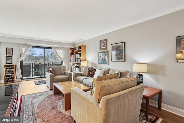 living room with crown molding and wood-type flooring