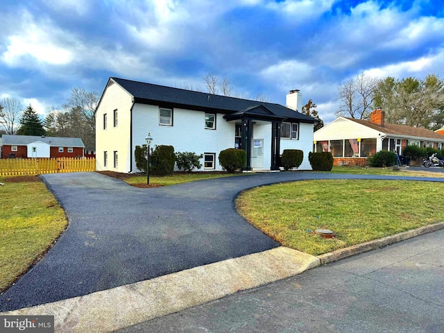 view of front of home with a front yard