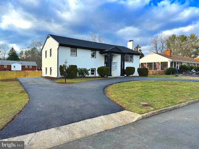 view of front of home with a front yard