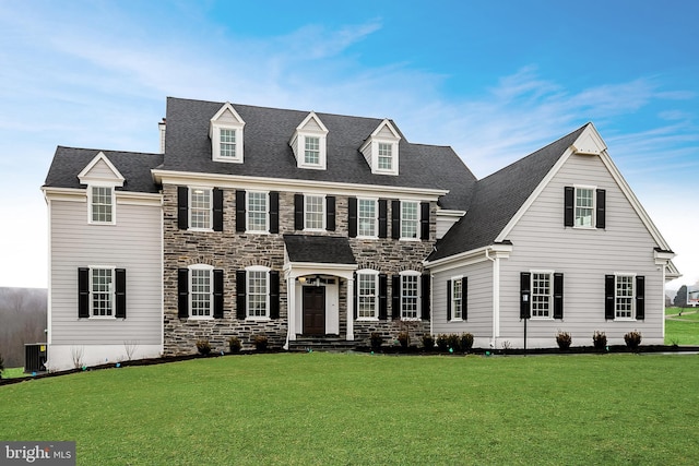 view of front of home with a front lawn